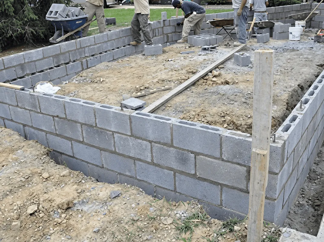 Professionals building a foundation with blocks in Savannah, GA