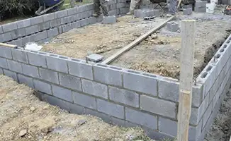 Professionals building a foundation with blocks in Savannah, GA